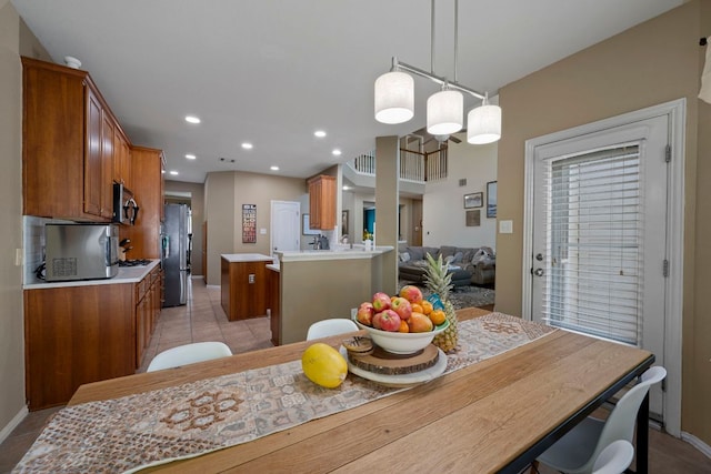 20300 Wayzata Ct, Pflugerville, TX 78660 - dining room featuring light tile patterned floors and recessed lighting