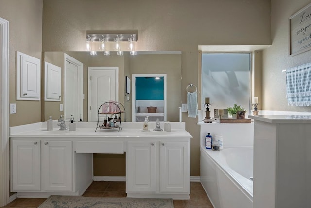 20300 Wayzata Ct, Pflugerville, TX 78660 - full bath featuring a garden tub, double vanity, and tile patterned floors
