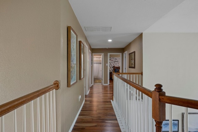 20300 Wayzata Ct, Pflugerville, TX 78660 - hall featuring an upstairs landing and dark wood-type flooring