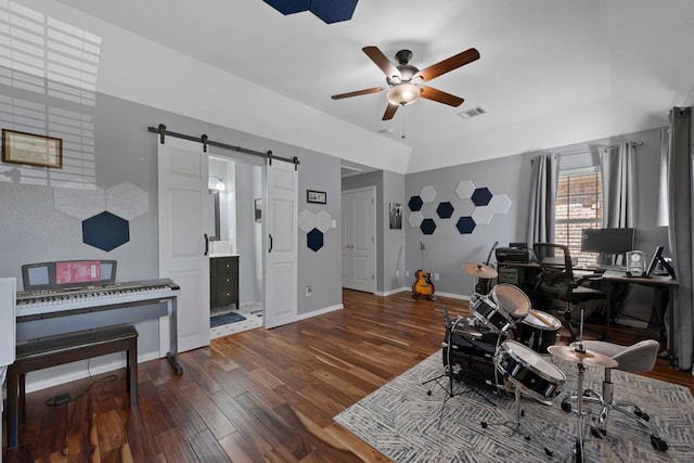20300 Wayzata Ct, Pflugerville, TX 78660 - office with a barn door, a ceiling fan, and wood finished floors