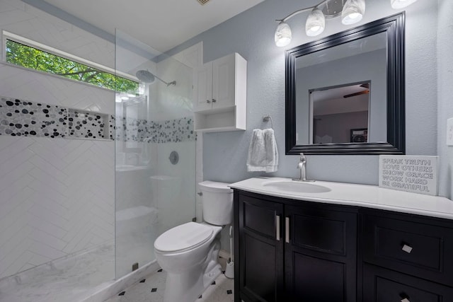 20300 Wayzata Ct, Pflugerville, TX 78660 - bathroom featuring a tile shower, vanity, and a textured wall
