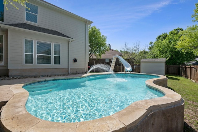20300 Wayzata Ct, Pflugerville, TX 78660 - view of pool with a water slide and a fenced backyard