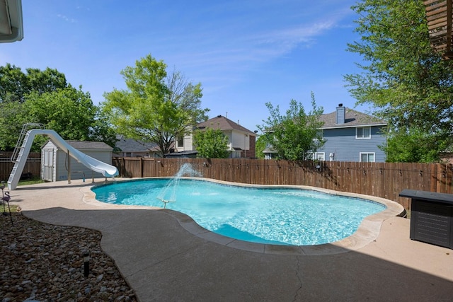 20300 Wayzata Ct, Pflugerville, TX 78660 - view of swimming pool with a water slide, a fenced backyard, a patio, and a shed