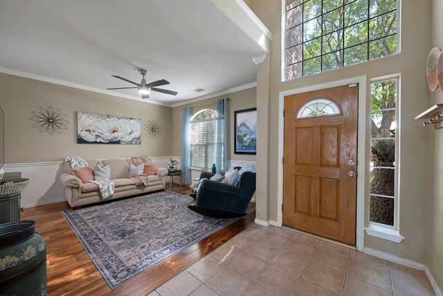 20300 Wayzata Ct, Pflugerville, TX 78660 - entrance foyer with crown molding, ceiling fan, and wood finished floors