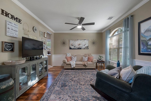 20300 Wayzata Ct, Pflugerville, TX 78660 - living area with ornamental molding, a wainscoted wall, ceiling fan, and dark wood-style flooring