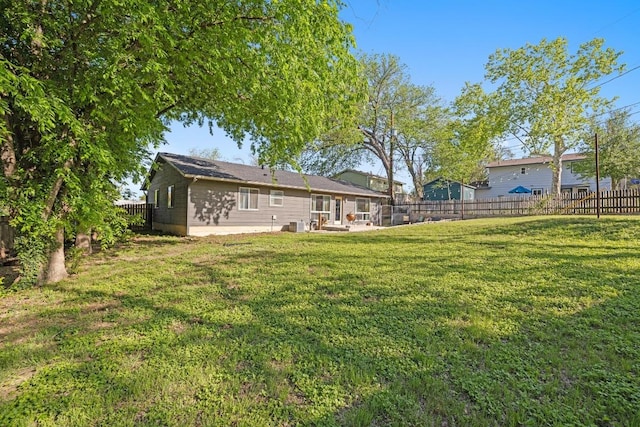 view of yard featuring a patio area and a fenced backyard