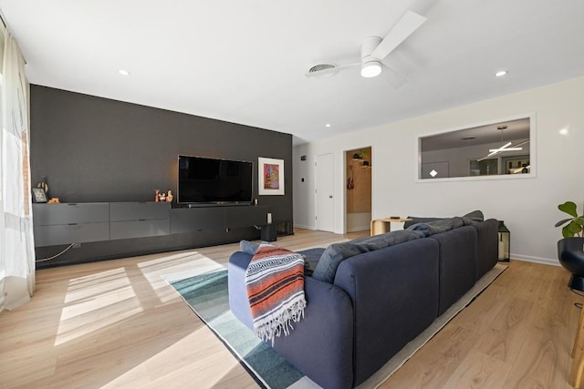 living room with ceiling fan, recessed lighting, wood finished floors, and baseboards