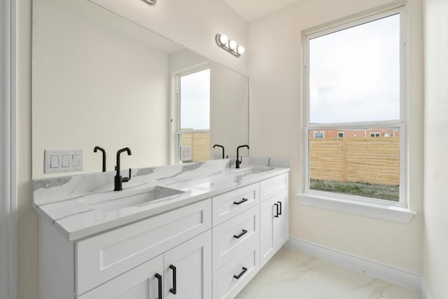 459 Rancho Linda Dr, Lockhart, TX 78644 - bathroom with plenty of natural light, baseboards, and a sink