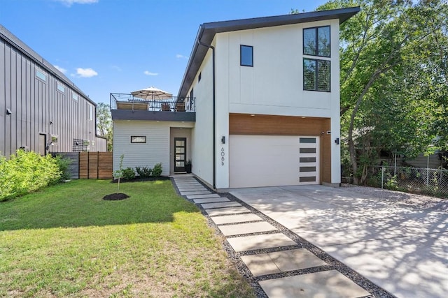 608B W 15th St, Georgetown, TX 78626 - contemporary house with concrete driveway, a balcony, and an attached garage