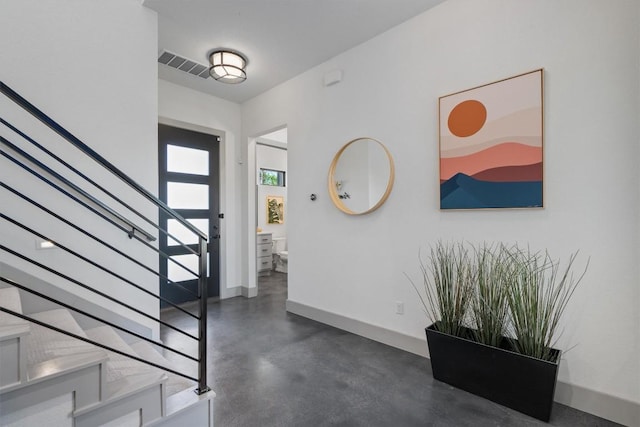 608B W 15th St, Georgetown, TX 78626 - entryway featuring stairs, finished concrete flooring, and baseboards