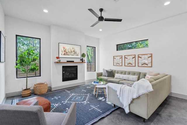 608B W 15th St, Georgetown, TX 78626 - living room with recessed lighting, ceiling fan, a glass covered fireplace, and baseboards