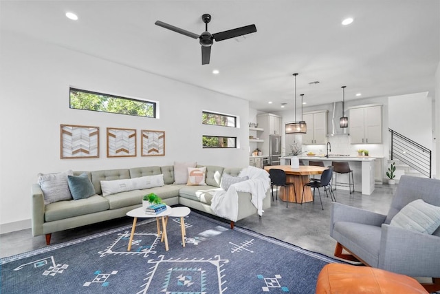 608B W 15th St, Georgetown, TX 78626 - living room with finished concrete flooring, healthy amount of natural light, recessed lighting, and a ceiling fan