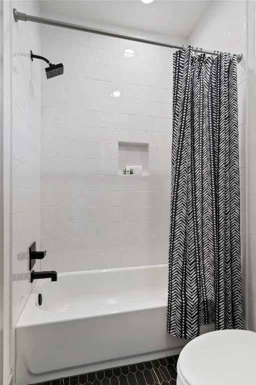 608B W 15th St, Georgetown, TX 78626 - full bath with shower / bath combination with curtain, toilet, and tile patterned floors