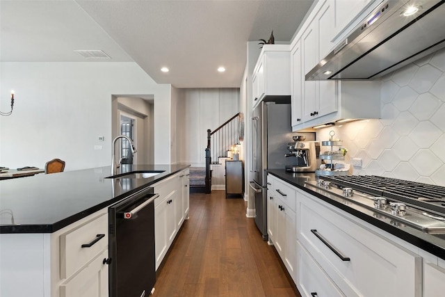 234 Sumalt Gap Way, Lakeway, TX 78738 - kitchen featuring ventilation hood, stainless steel appliances, dark countertops, decorative backsplash, and recessed lighting