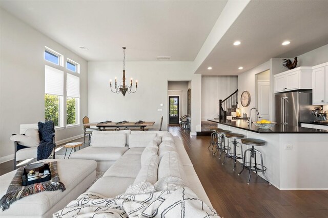 234 Sumalt Gap Way, Lakeway, TX 78738 - living area with stairway, dark wood-style floors, a chandelier, and recessed lighting
