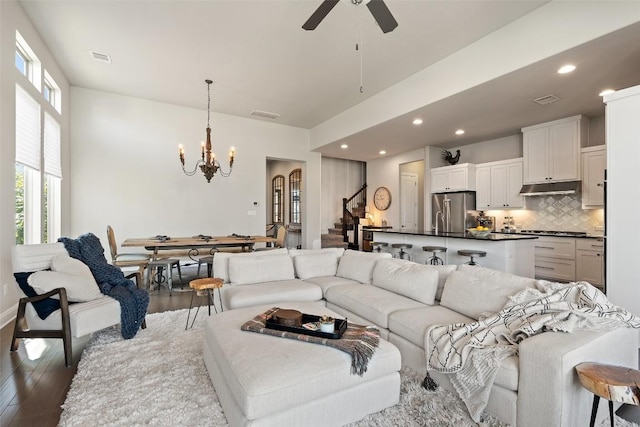 234 Sumalt Gap Way, Lakeway, TX 78738 - living room featuring a chandelier, wood finished floors, stairs, recessed lighting, and ceiling fan