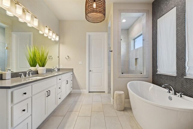 234 Sumalt Gap Way, Lakeway, TX 78738 - bathroom featuring double vanity, a freestanding bath, tile patterned floors, and tiled shower