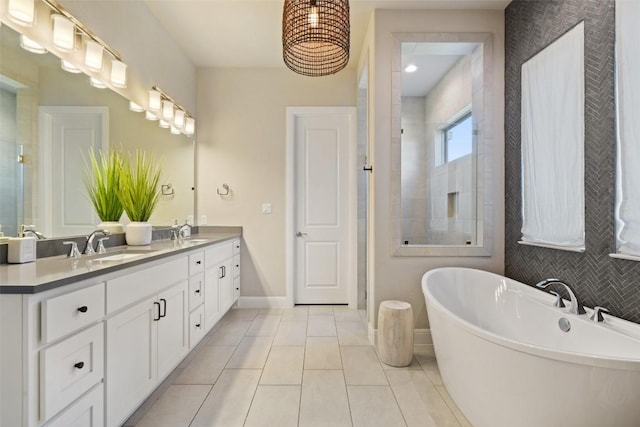 234 Sumalt Gap Way, Lakeway, TX 78738 - bathroom with double vanity, a freestanding bath, tiled shower, and tile patterned floors