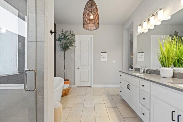 234 Sumalt Gap Way, Lakeway, TX 78738 - full bathroom with double vanity, a freestanding tub, a shower stall, and tile patterned floors