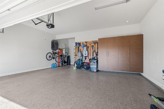 234 Sumalt Gap Way, Lakeway, TX 78738 - garage with a garage door opener and baseboards