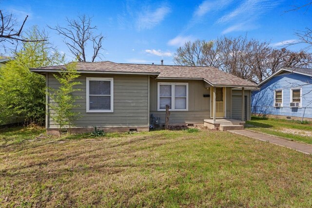 5708 Ave F, Austin, TX 78752 - bungalow featuring crawl space, a front lawn, and a shingled roof