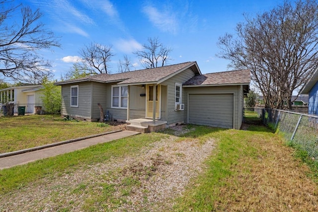 5708 Ave F, Austin, TX 78752 - ranch-style house featuring driveway, crawl space, an attached garage, a shingled roof, and cooling unit