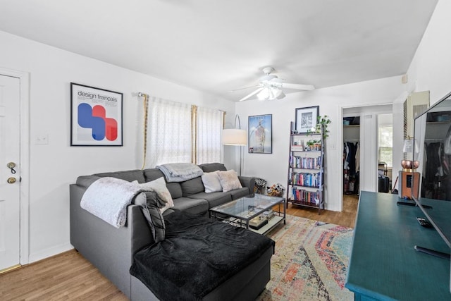 5708 Ave F, Austin, TX 78752 - living area with a ceiling fan and wood finished floors