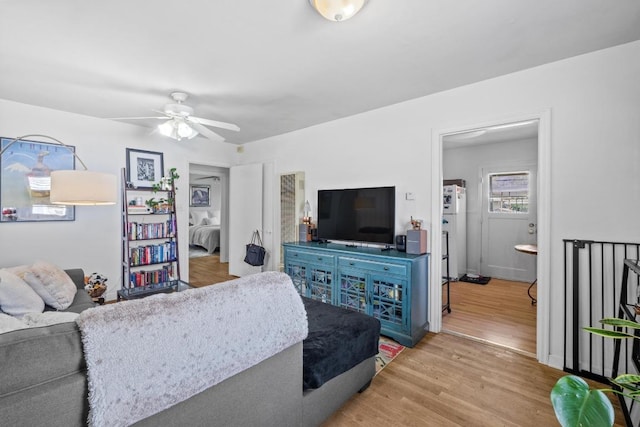 5708 Ave F, Austin, TX 78752 - living area with ceiling fan and wood finished floors
