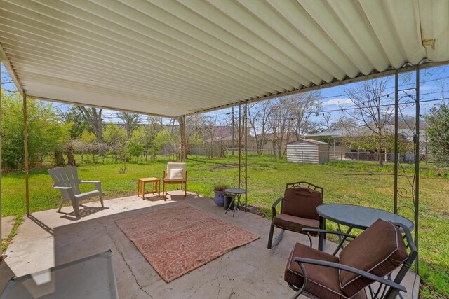 5708 Ave F, Austin, TX 78752 - fenced backyard featuring a patio area and a storage shed