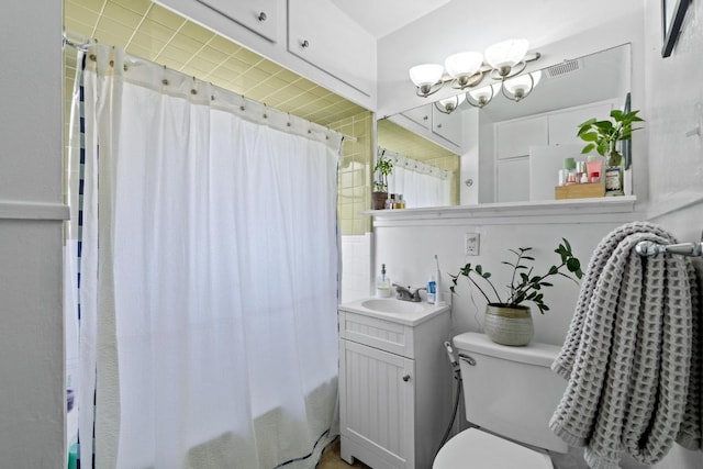 5708 Ave F, Austin, TX 78752 - full bath featuring vanity, shower / bath combo with shower curtain, and a chandelier