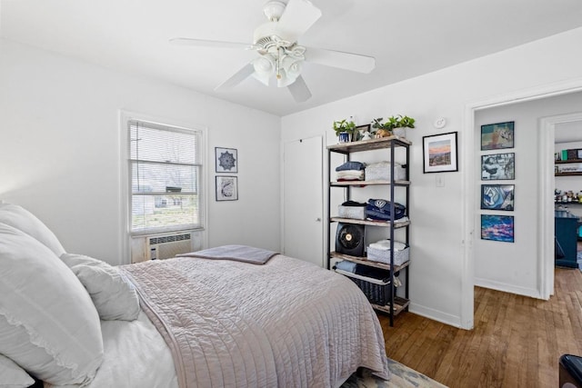 5708 Ave F, Austin, TX 78752 - bedroom featuring wood finished floors, cooling unit, and ceiling fan