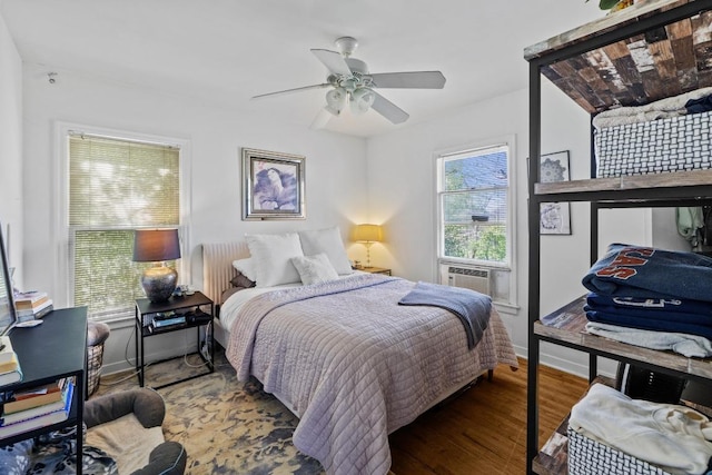 5708 Ave F, Austin, TX 78752 - bedroom with wood finished floors, cooling unit, and a ceiling fan