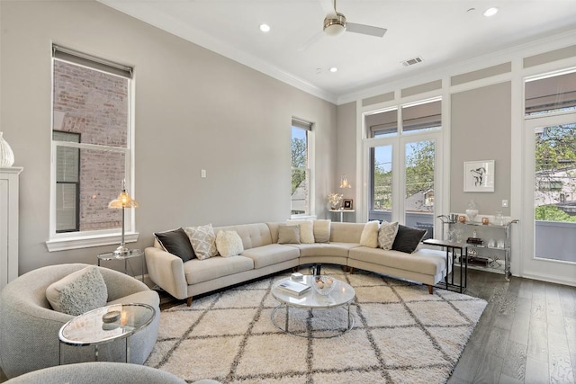 1015 Juniper St, Austin, TX 78702 - living area featuring a wealth of natural light, recessed lighting, ornamental molding, and wood-type flooring