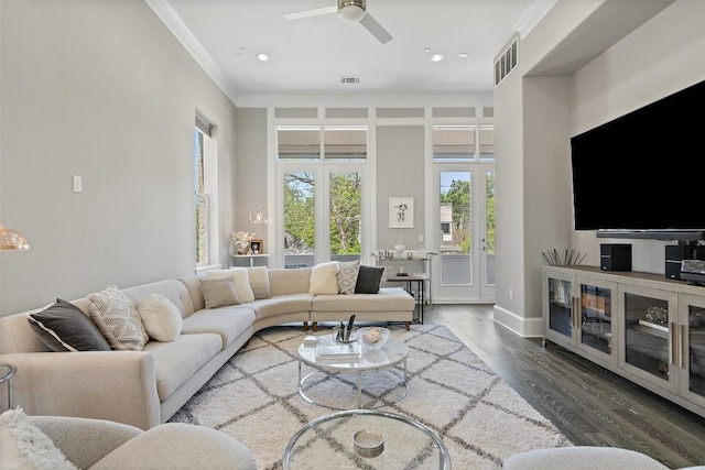 1015 Juniper St, Austin, TX 78702 - living area with wood finished floors, visible vents, a ceiling fan, and ornamental molding
