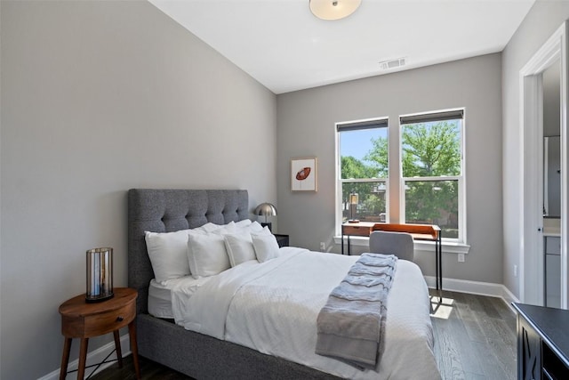 1015 Juniper St, Austin, TX 78702 - bedroom with visible vents, baseboards, and dark wood-type flooring