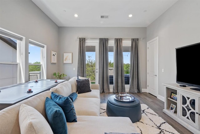 1015 Juniper St, Austin, TX 78702 - living area featuring recessed lighting, visible vents, and wood finished floors
