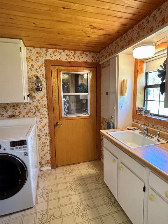 interior space featuring washer / dryer, wooden ceiling, and wallpapered walls