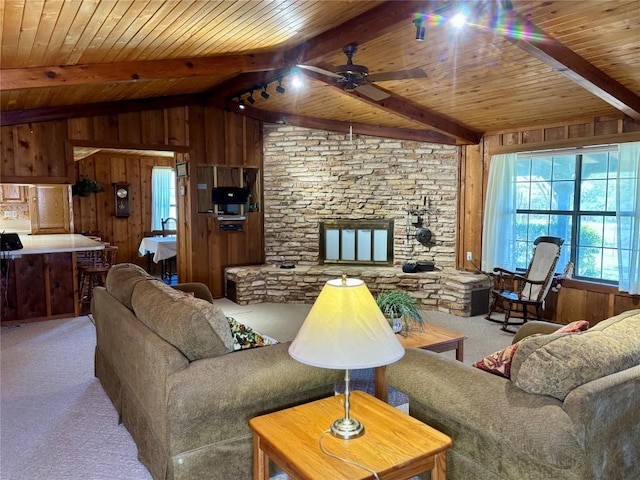 living room featuring wood ceiling, carpet flooring, and wooden walls