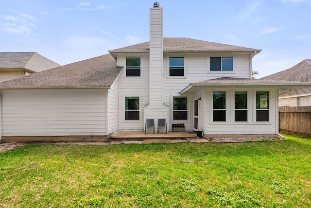 12528 E Labrador Cv, Austin, TX 78729 - rear view of property featuring a patio area, a chimney, and roof with shingles