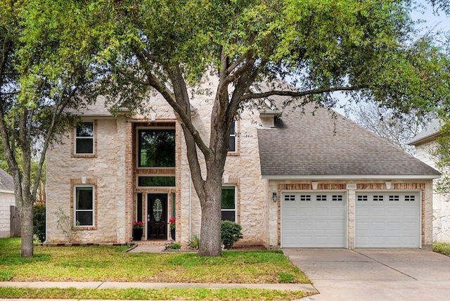 12528 E Labrador Cv, Austin, TX 78729 - view of front of house with driveway, an attached garage, roof with shingles, and a front lawn