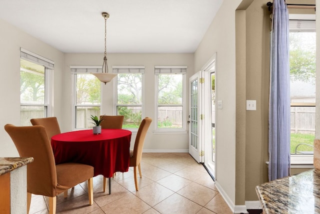 12528 E Labrador Cv, Austin, TX 78729 - dining space featuring baseboards and light tile patterned flooring