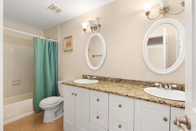 12528 E Labrador Cv, Austin, TX 78729 - bathroom with double vanity, tile patterned floors, and shower / tub combo with curtain
