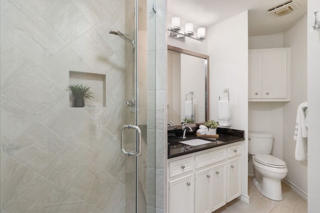 30203 Hacienda Ln, Georgetown, TX 78628 - bathroom with vanity, a shower stall, and tile patterned floors