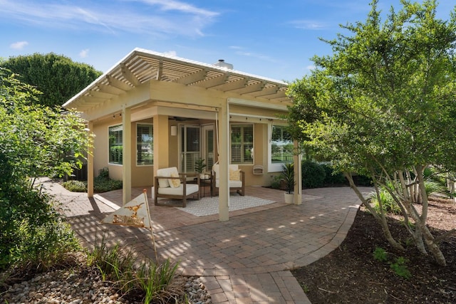 30203 Hacienda Ln, Georgetown, TX 78628 - back of house with a pergola, a patio, and stucco siding