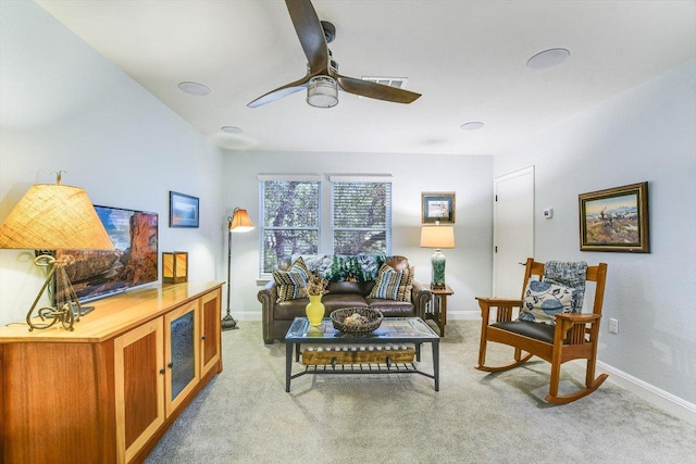 603 Archer Ln, Georgetown, TX 78633 - living area featuring light carpet, baseboards, and ceiling fan
