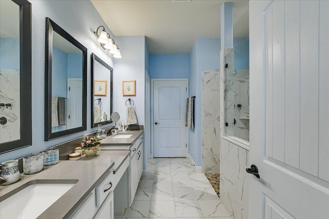 603 Archer Ln, Georgetown, TX 78633 - full bathroom with a sink, a marble finish shower, marble finish floor, and double vanity