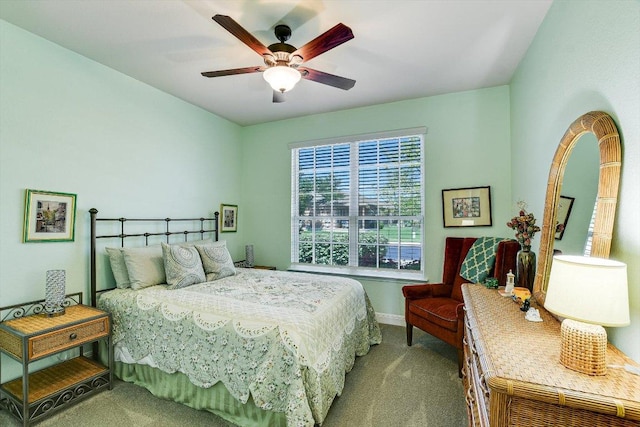 603 Archer Ln, Georgetown, TX 78633 - bedroom featuring carpet floors, baseboards, and a ceiling fan