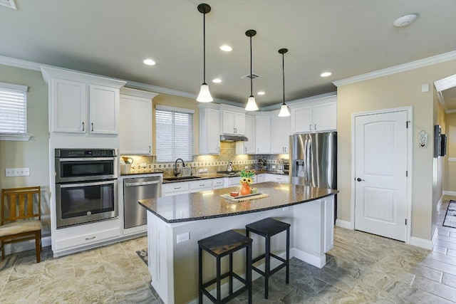 603 Archer Ln, Georgetown, TX 78633 - kitchen with a sink, ornamental molding, and appliances with stainless steel finishes