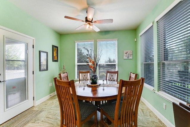 603 Archer Ln, Georgetown, TX 78633 - dining space with ceiling fan, baseboards, and stone finish flooring