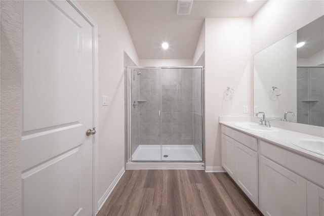 1850 Settlers Glen Dr Unit 904, Round Rock, TX 78665 - full bath with baseboards, a stall shower, visible vents, a sink, and wood finished floors